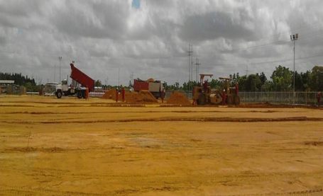 Dump truck working on ground leveling and site preparation