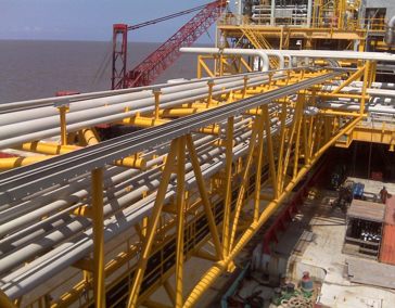 Yellow piping structure installed on an offshore platform